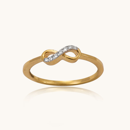 Embrace eternal love with our delicate 18 kt gold Infinity Simple Ring adorned with natural diamonds. Perfect for everyday wear, work, or casual looks, this ring features a sparkling diamond, adding a touch of elegance to any ensemble. An ideal gifting idea for her.