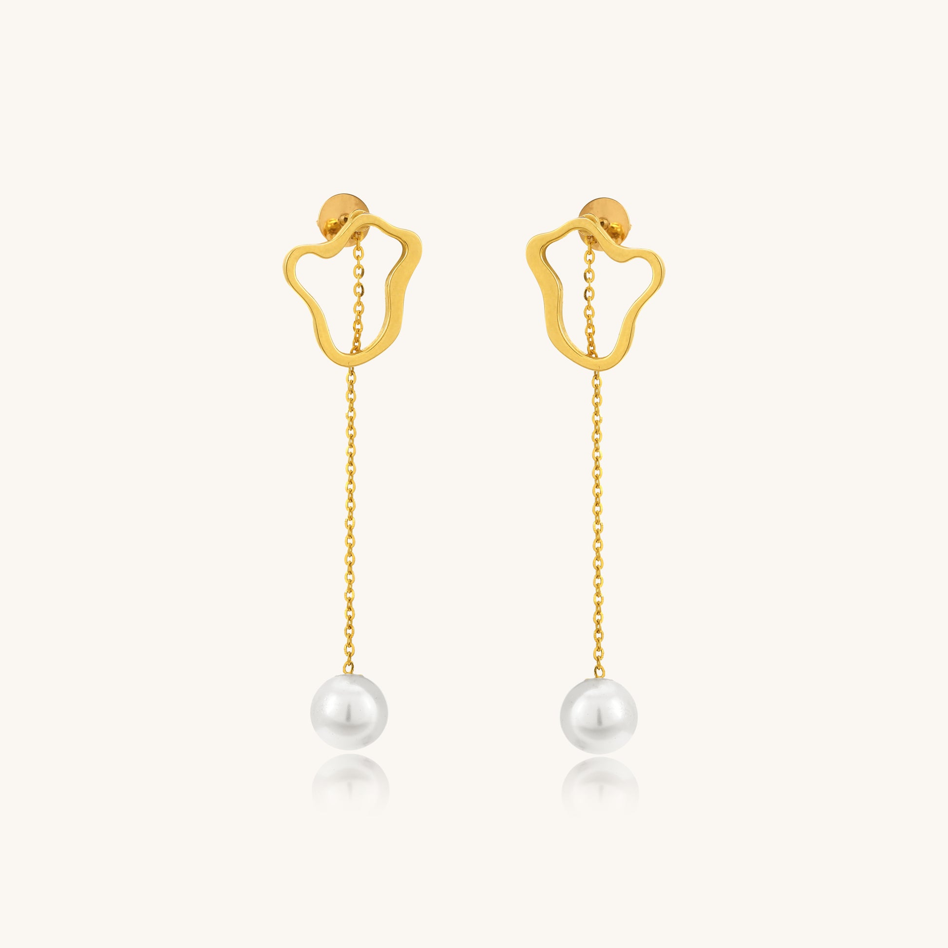 Add timeless elegance with our Pearl Dangling Earrings crafted in lustrous 18kt gold under Rs. 30,000. A perfect jewellery gift for any occasion, whether it's a birthday or an anniversary.