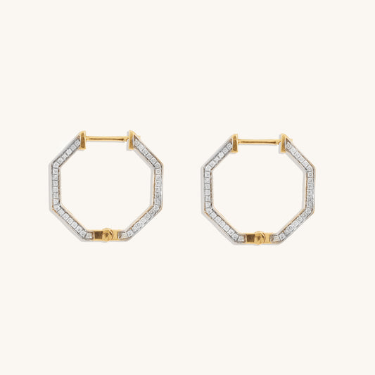 Hexagon diamond earrings crafted with 18 kt gold. Sophisticated daily wear jewellery for women. Elegant everyday diamond earrings. A luxurious classic gift idea for her.