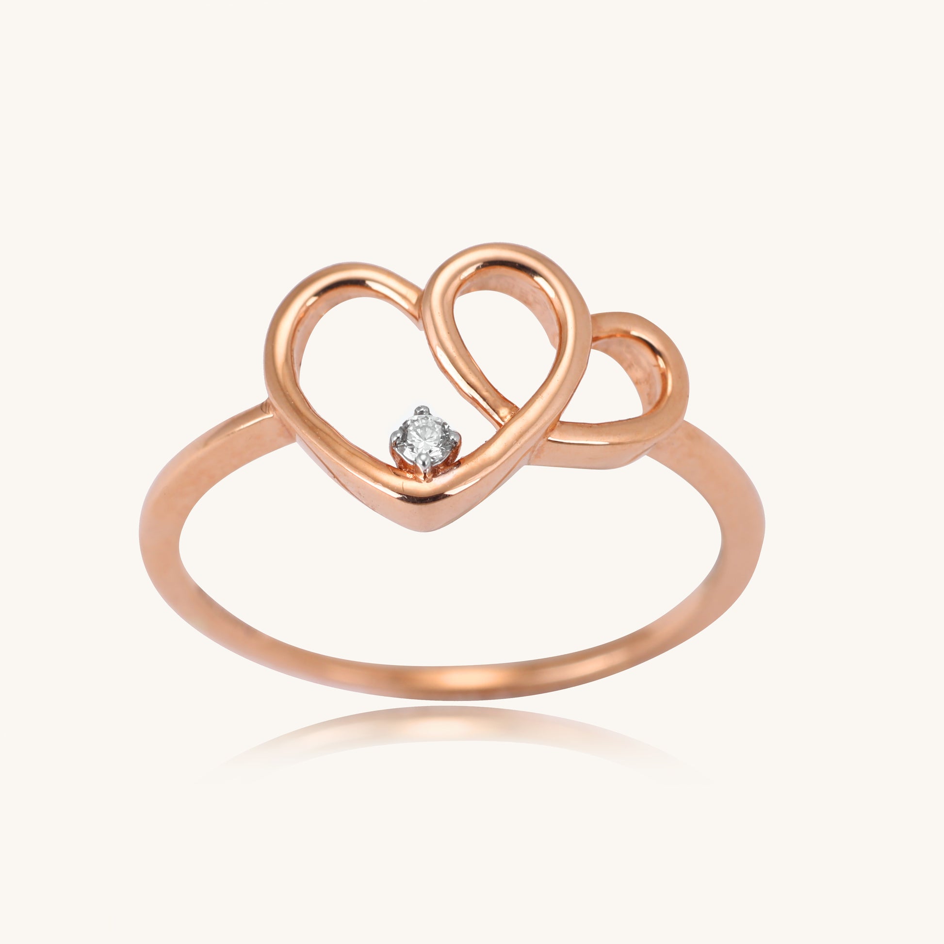 Elevate your everyday style with our delicate 18 kt gold Entwined Heart Ring, adorned with natural diamonds for Women. This charming diamond ring is perfect for casual, work, or everyday wear, adding a touch of love to your look. An ideal gift for her under 30,000, it's a timeless expression of affection. 