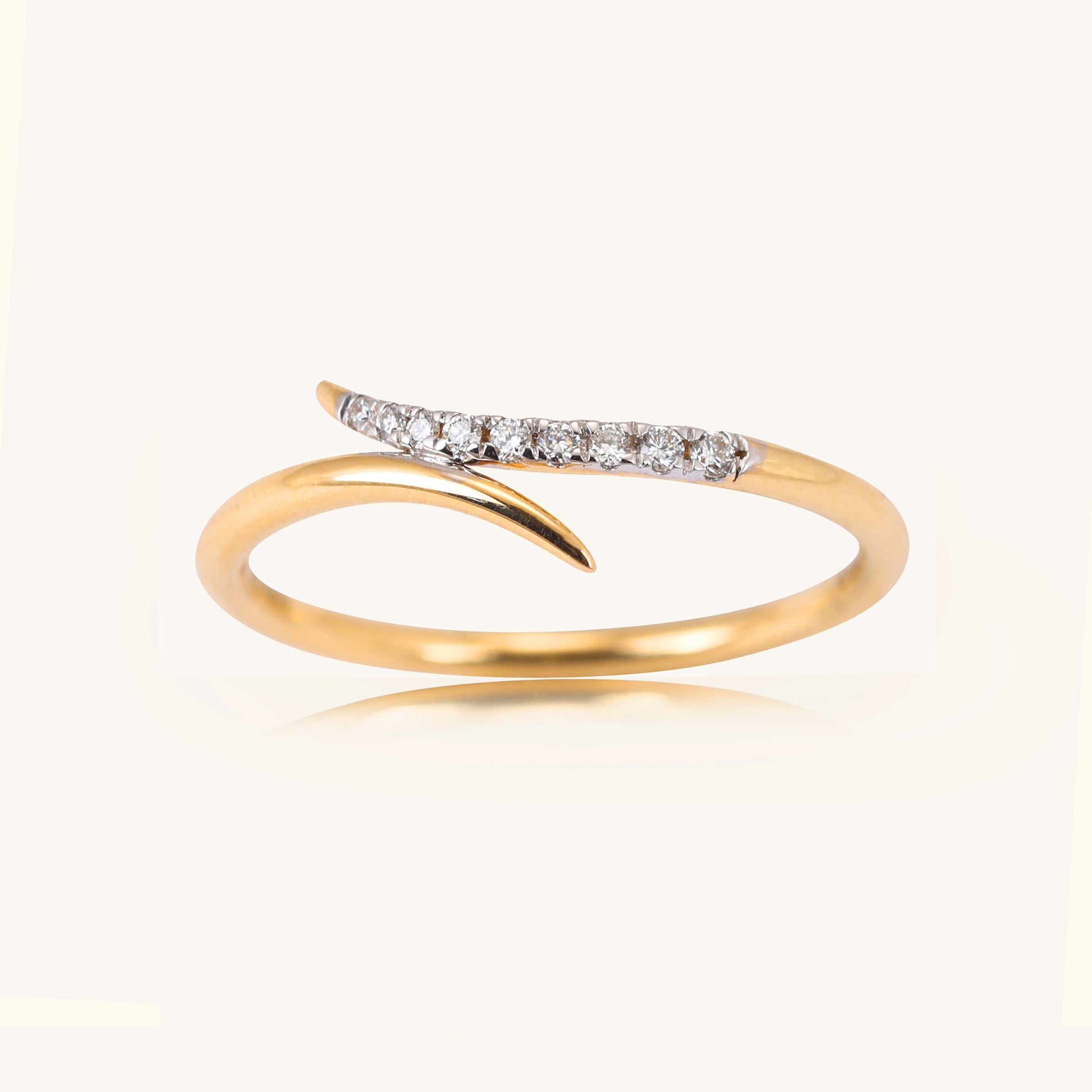 Dive into elegance with our 18 kt Teensy Wave Ring, a stunning addition from our spring edit collection, all priced affordably under Rs. 30,000. This exquisite jewellery piece effortlessly transitions from day to night, ensuring versatility for any ensemble. Ideal for gifting, it adds a touch of sophistication to her collection.