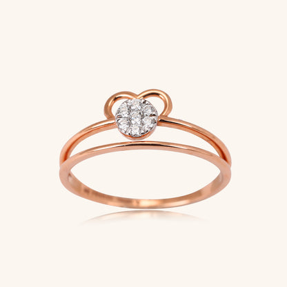 Elevate your everyday style with the Radiant Heart Ring, a stunning 18kt gold piece featuring a captivating heart-shaped diamond center. This versatile ring seamlessly transitions from work to weekend, adding elegance to any ensemble. Perfect for gifting or personal wear, it's a thoughtful addition to your jewellery collection under 30,000