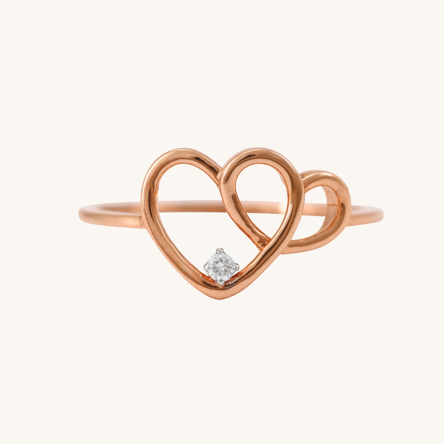 Elevate your everyday style with our delicate 18 kt gold Entwined Heart Ring, adorned with natural diamonds for Women. This charming diamond ring is perfect for casual, work, or everyday wear, adding a touch of love to your look. An ideal gift for her under 30,000, it's a timeless expression of affection. 