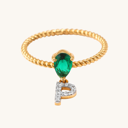 Elevate your look with our stunning 18 kt gold P Drop Ring, featuring a captivating emerald. Priced under 30,000, it's a thoughtful gifting idea for her. Versatile for everyday wear, this ring seamlessly transitions from work to weekend, complementing both casual and formal looks. 