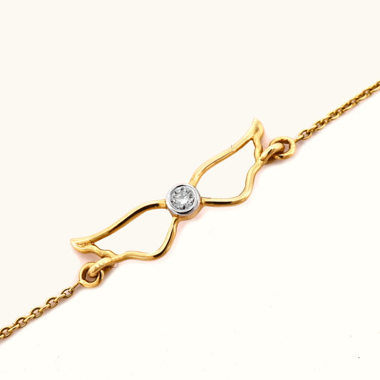 Luxurious 18kt gold Winged Diamond Bracelet elevates everyday style. Delicate and eye-catching, this bracelet transitions flawlessly from workwear to casual looks. Perfect gift under Rs. 30,000.