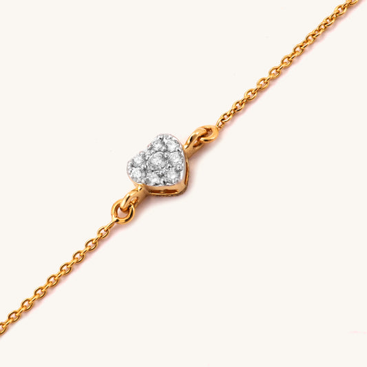 Elevate your everyday style with the 18kt Shining Heart Bracelet crafted with diamond. This delicate and feminine piece is perfect for everyday wear, work attire, and casual looks, making it an ideal gifting idea for her. Priced under Rs. 30,000, this elegant bracelet is a must-have addition to your accessory collection, effortlessly elevating any outfit.