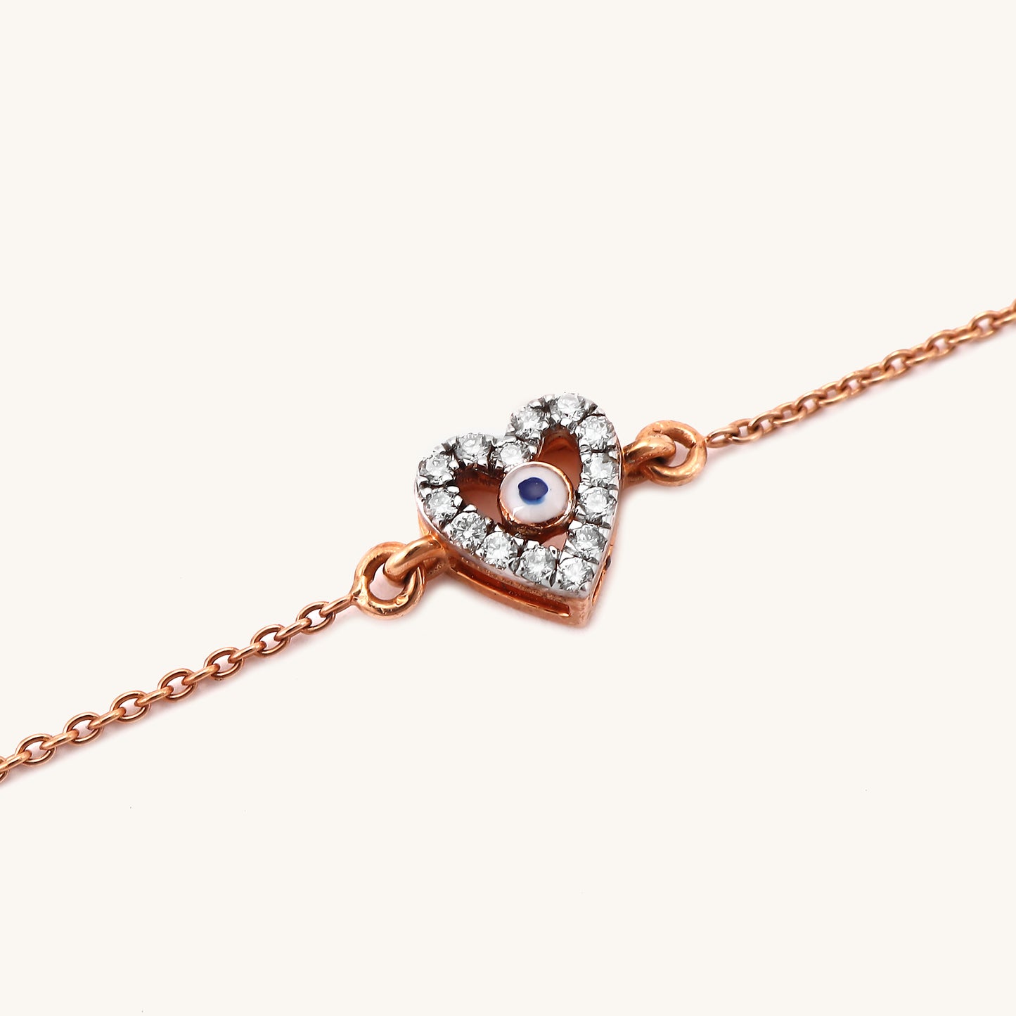 Embrace the power of the evil eye with this 18kt Gold Evil Eye Heart Diamond Bracelet. This elegant everyday accessory adds a touch of luck and protection to any casual or workwear outfit. Explore our Under 30,000 Collection for more thoughtful gift ideas for her or to elevate your own everyday jewellery style with luxurious, yet affordable pieces.