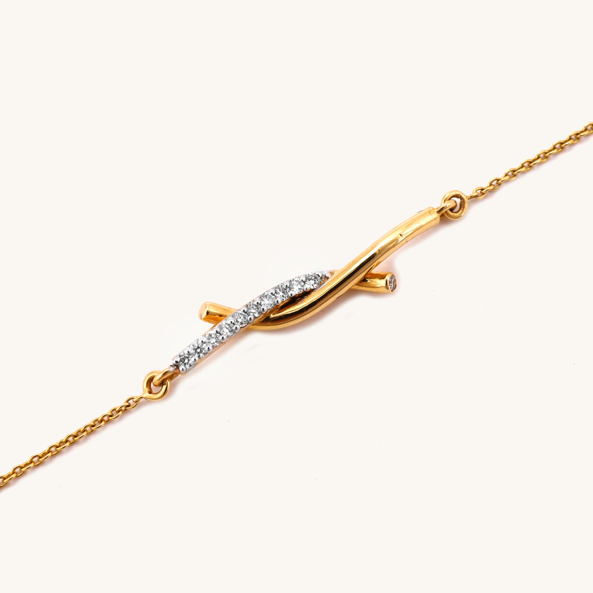 Discover timeless elegance with our 18kt Gold Entwined Diamond Bracelet from the spring edit collection. Priced under Rs. 30,000, this exquisite piece is perfect for everyday wear and gifting, adding sophistication to any outfit. Treat yourself or your loved ones to this luxurious accessory, crafted to elevate your style.