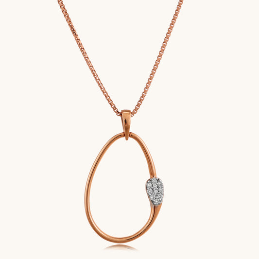  Elevate your daily elegance with our enchanting 18 kt gold oval diamond pendant, priced under 30,000 for women. Adorned with a delicate diamond, it's an ideal choice for gifting or adding a hint of sparkle to your workwear, casual attire, or everyday look.