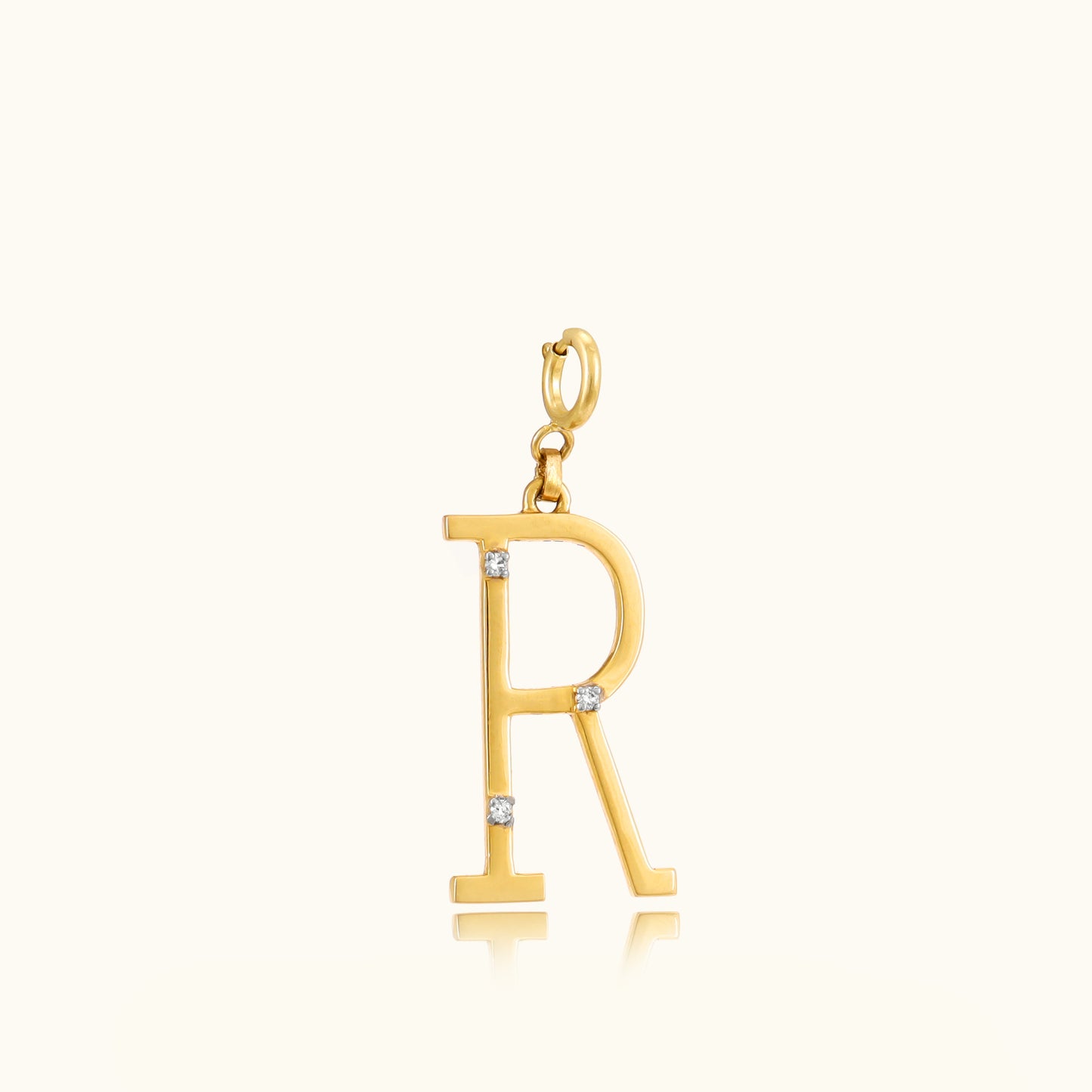 Add a personal touch to your style with our elegant 18 kt gold Letter R Pendant. Perfect for everyday wear, workwear, or evening attire, this pendant adds a unique sparkle to any outfit. Whether it's a gift for someone special or a treat for yourself, it's priced under 10,000. Explore our Under 10,000 collection and find your perfect letter.