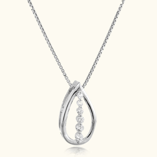 Indulge in timeless elegance with our 18 kt Teardrop Diamond Pendant from the Spring Edit collection, priced below 30,000. This exquisite piece is a must-have addition to your everyday jewelry collection, radiating sophistication and grace. Whether for personal adornment or as a heartfelt gift.