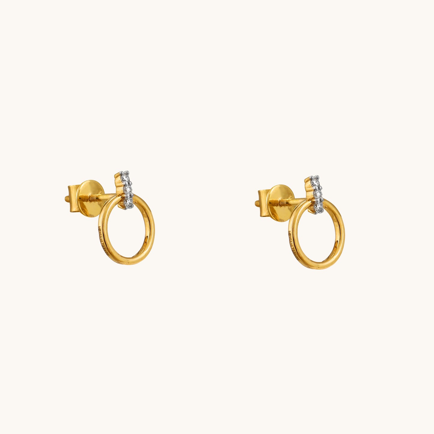 Elevate your style with the Circlet Diamond Earrings, crafted in 18kt gold and adorned with delicate diamonds. Perfect for everyday wear or adding a touch of sophistication to work or casual attire, these hoop earrings exude timeless elegance. A thoughtful and affordable gift idea for her under Rs. 30,000, these earrings are sure to impress. 