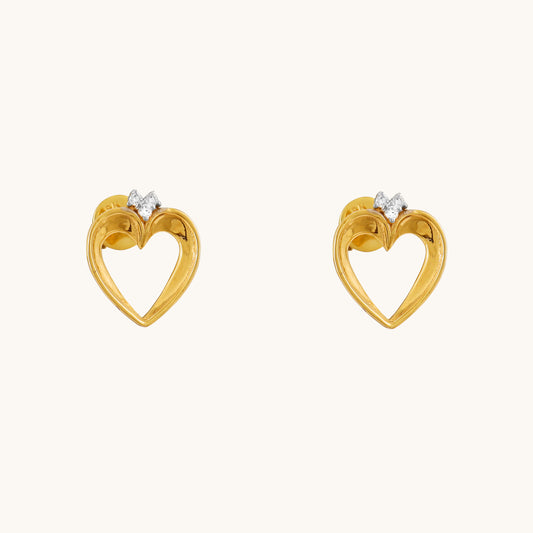 Show your love with a touch of understated elegance. These Lining Heart Earrings, crafted in 18kt gold and featuring a delicate heart design, are perfect for everyday wear. They're versatile enough for casual looks, work attire, or special occasions. A thoughtful and affordable gift idea for her under Rs. 30,000.