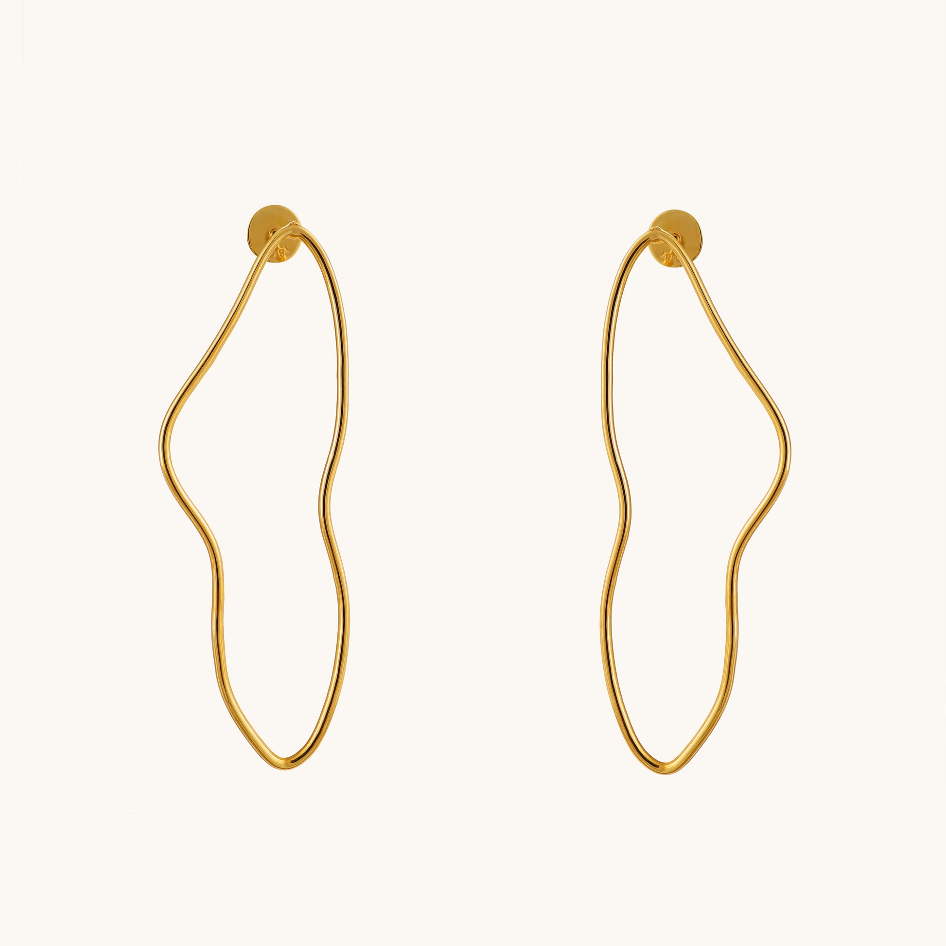 Elevate your everyday elegance with our Swirl Gold Earrings, meticulously crafted in 18kt gold, seamlessly complementing any casual or workwear ensemble with a touch of luxury. Ideal for gifting, explore our Under 30,000 collection for affordable yet exquisite pieces that add sophistication to every look. 