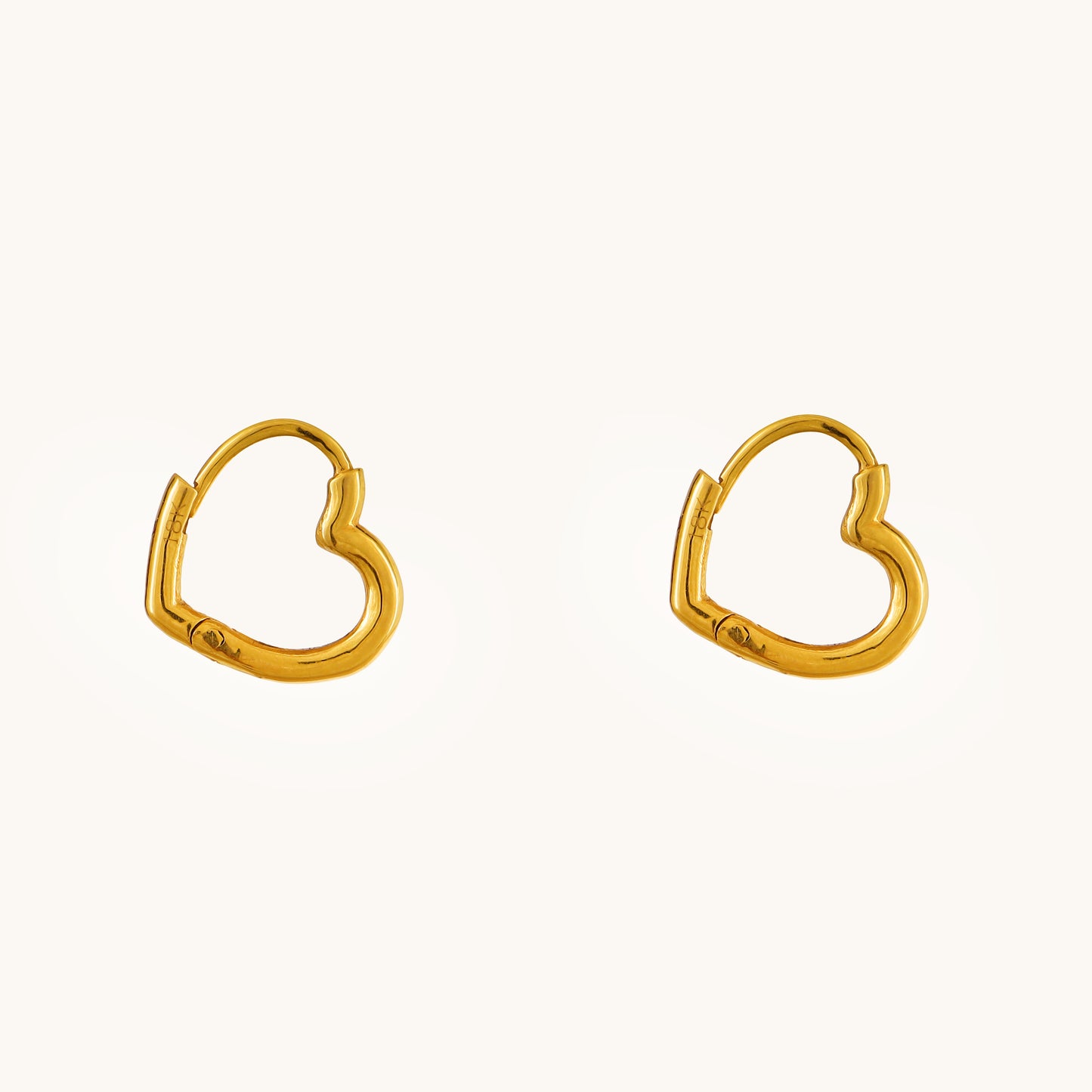 Express your love in style with the Gold Heart Hoop Earrings crafted in 18kt gold under Rs. 30,000. These earrings are a perfect way to add a touch of everyday romance to your look. Versatile enough for casual wear, work attire, or a special occasion, they make a thoughtful and delightful gift idea for her.