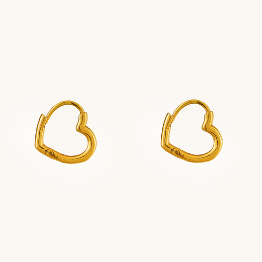 Express your love in style with the Gold Heart Hoop Earrings crafted in 18kt gold under Rs. 30,000. These earrings are a perfect way to add a touch of everyday romance to your look. Versatile enough for casual wear, work attire, or a special occasion, they make a thoughtful and delightful gift idea for her.