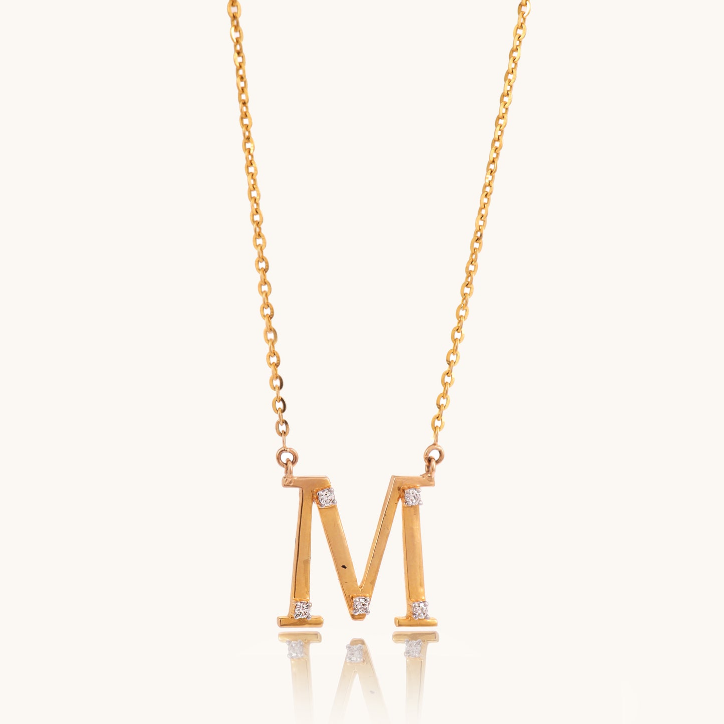 Close-up of the Diamond Alphabet M Necklace by Caratly, featuring 18kt gold and IGI-certified diamonds. A perfect blend of elegance and affordability, ideal for everyday wear or gifting under Rs. 30K.