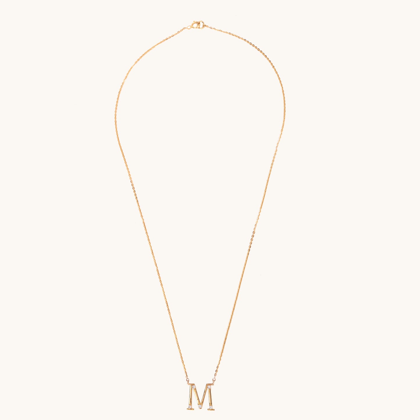 Diamond Alphabet M Necklace by Caratly, featuring 18kt gold and IGI-certified diamonds. A perfect blend of elegance and affordability, ideal for everyday wear or gifting under Rs. 30K.