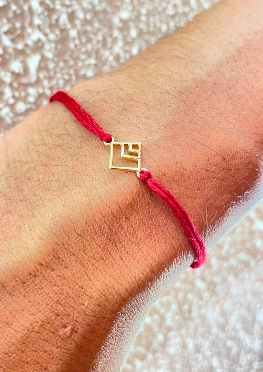 18kt gold square pattern rakhi featuring elegant design for Raksha Bandhan under Rs. 10,000