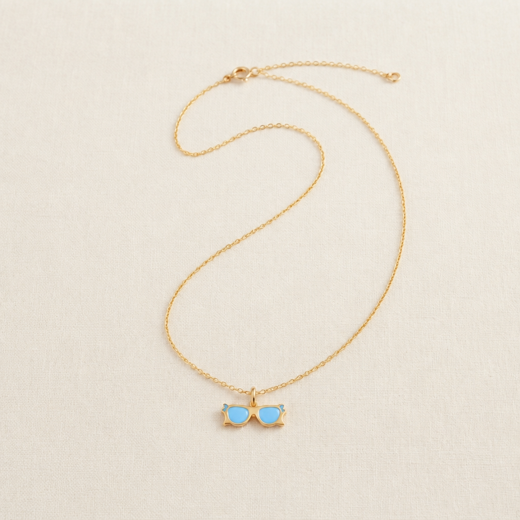 Gold sunglasses-shaped pendant with blue enamel lenses under Rs. 15,000
