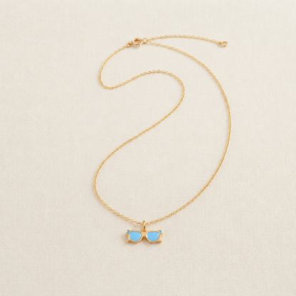 Gold sunglasses-shaped pendant with blue enamel lenses under Rs. 15,000