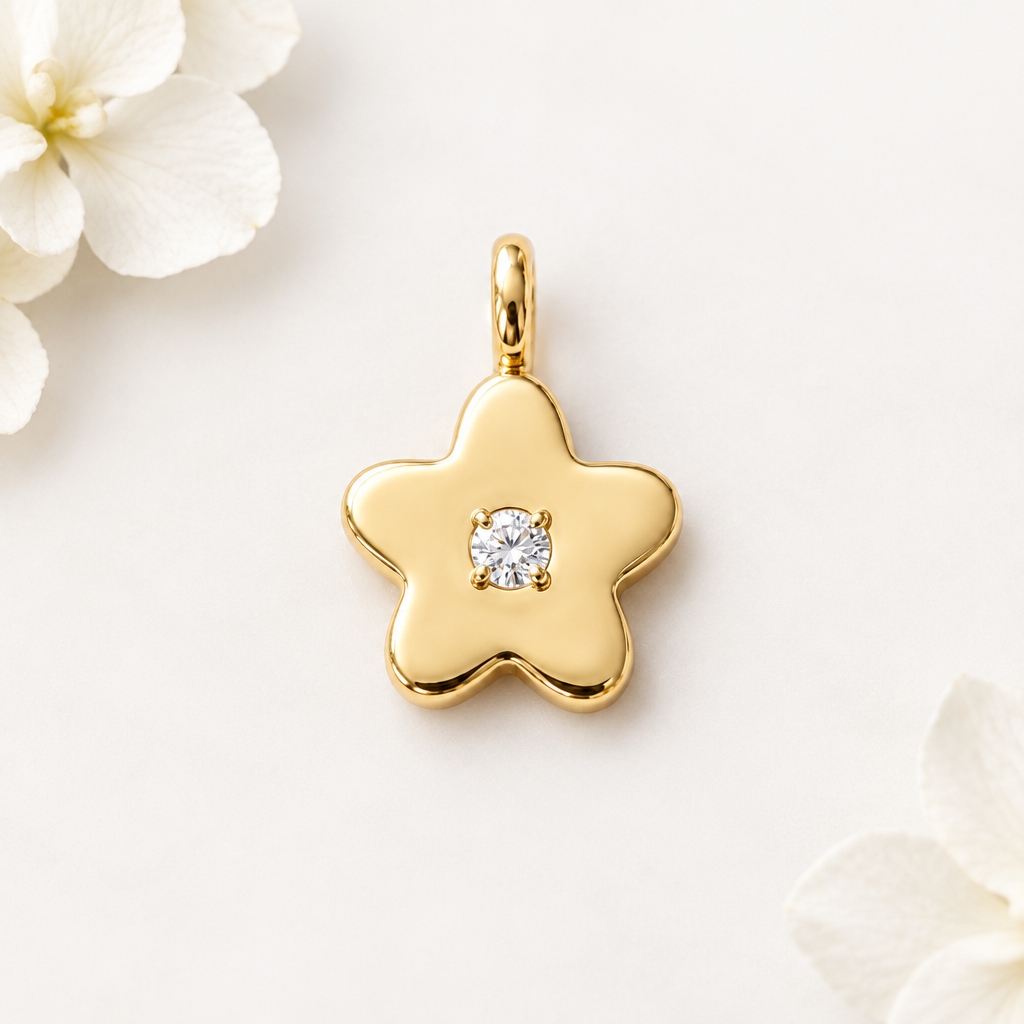 Gold star-shaped flower pendant set with a single sparkling diamond, priced under Rs. 25,000
