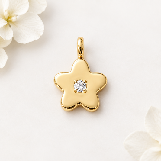 Gold star-shaped flower pendant set with a single sparkling diamond, priced under Rs. 25,000