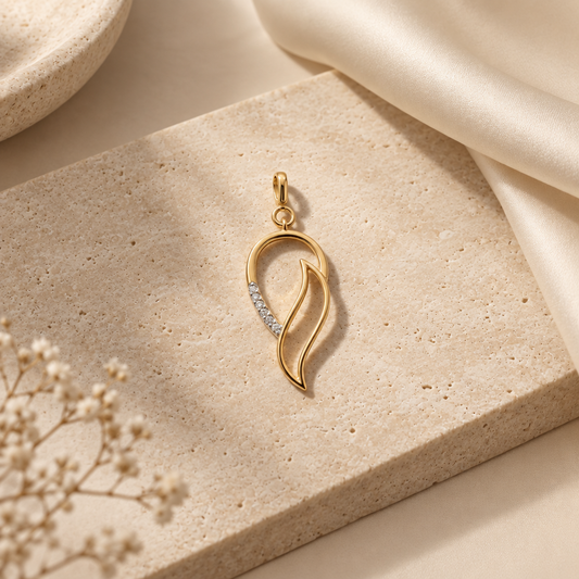Gold conch shell-shaped pendant with a diamond-set curved detail, priced under Rs. 20,000
