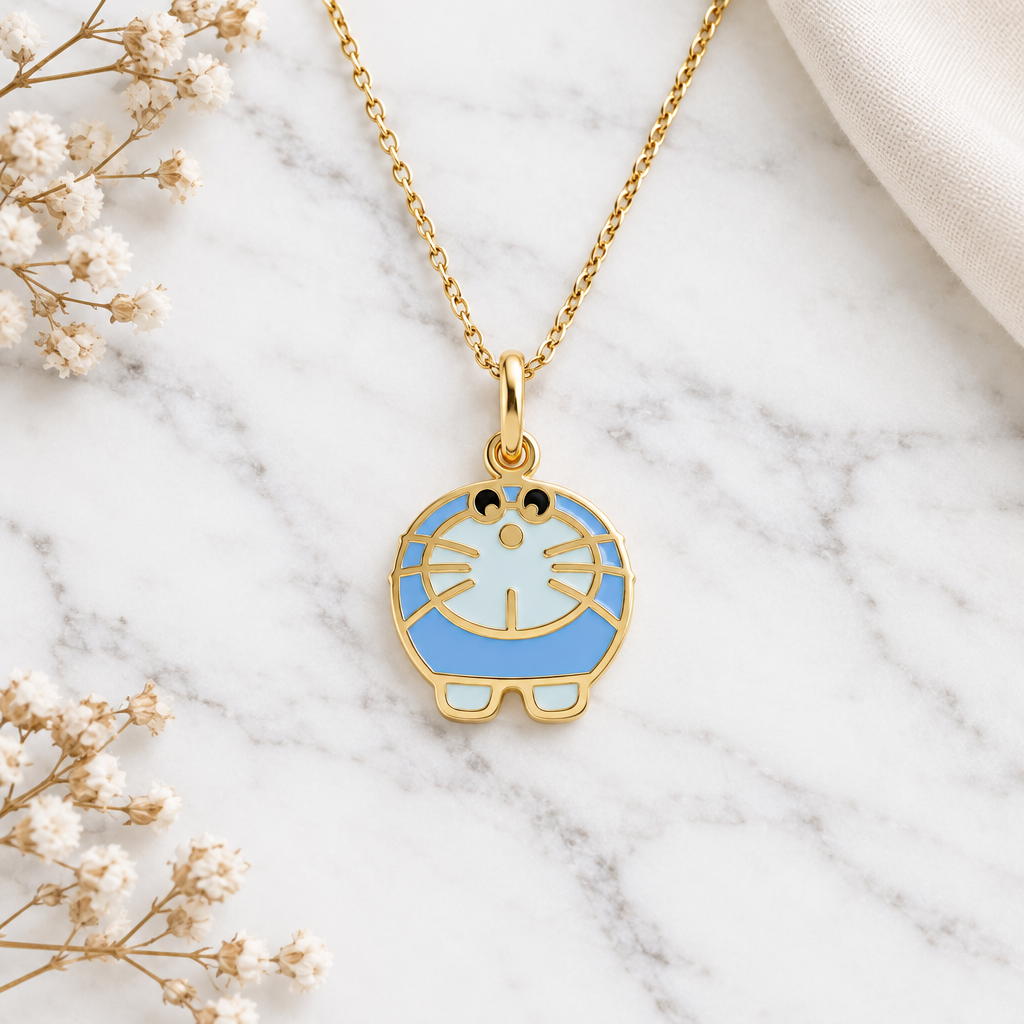 Gold Doraemon character pendant with blue and white enamel detailing.