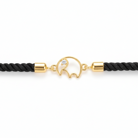Black rope men's bracelet with an 18kt gold elephant charm and a diamond accent. A gold gift for him under Rs. 15,000