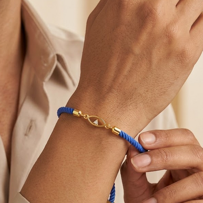 Blue rope men's bracelet with an 18kt gold evil eye charm and diamond accent. Minimal gift for him under Rs. 15,000