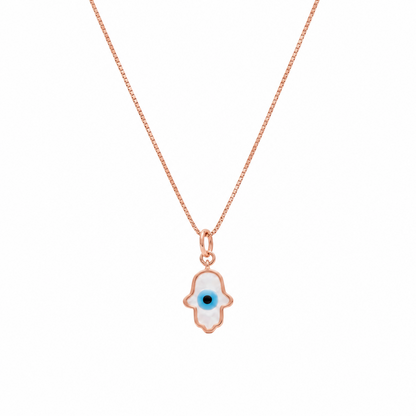 Gold hamsa hand pendant outlined in white enamel with a blue evil eye center. Protective gifts for her under Ra, 15,000