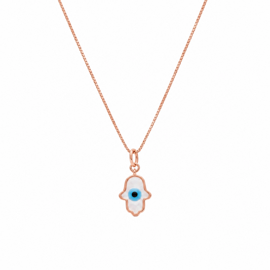Gold hamsa hand pendant outlined in white enamel with a blue evil eye center. Protective gifts for her under Ra, 15,000
