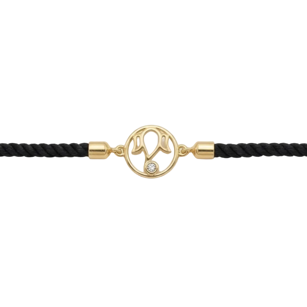Sleek black braided cord Ganesha Bracelet centered with a polished 18kt gold deity motif and a sparkling diamond. A perfect gift for him under Rs. 20,000