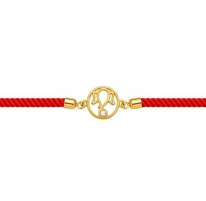 Vibrant red cord Ganpati Bracelet featuring a central 18kt gold motif accented with a delicate diamond. Gift men's bracelet under Rs. 20,000