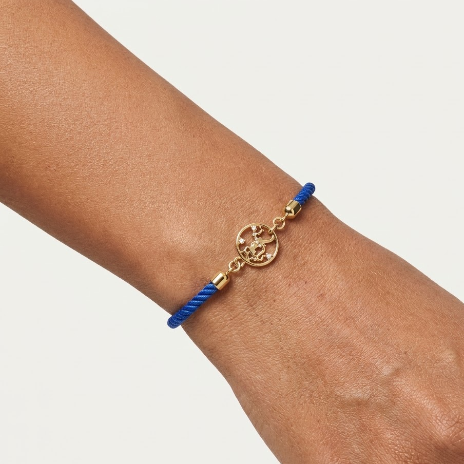 Blue rope men's bracelet with an 18kt gold Hanuman Ji pendant and diamond accents, on white background. Gift for him under Rs. 15,000