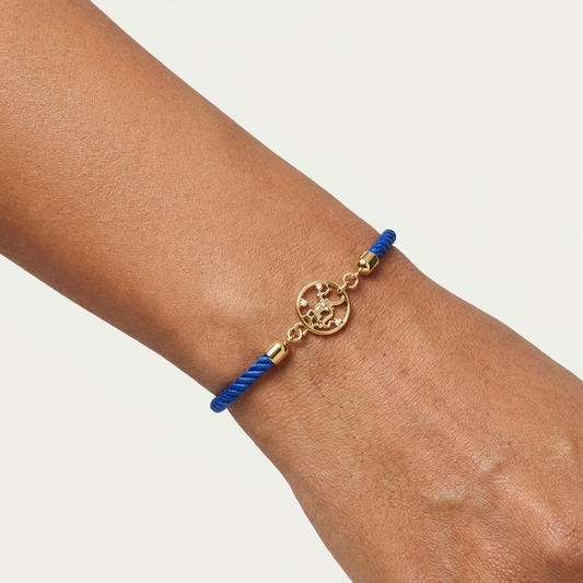Blue rope men's bracelet with an 18kt gold Hanuman Ji pendant and diamond accents, on white background. Gift for him under Rs. 15,000