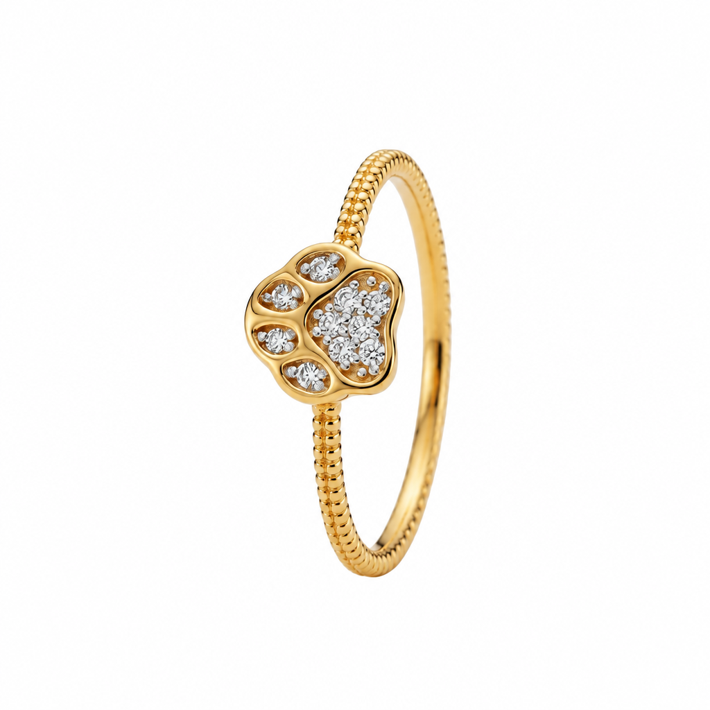 Gold ring with a heart-shaped paw print charm set with sparkling diamonds under Rs. 35,000