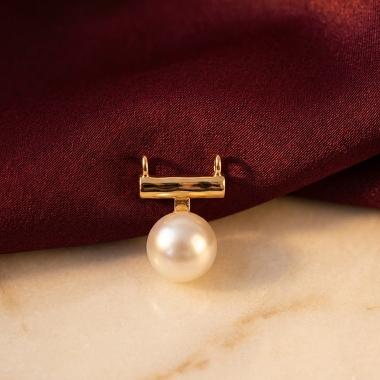Gold bar-style pendant holding a large lustrous white pearl priced under Rs. 20,000
