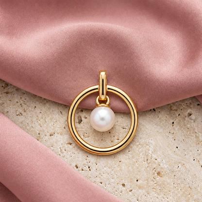 Gold circle pendant with a lustrous white pearl set at its centre. Minimal and cute gifts under Rs. 15,000