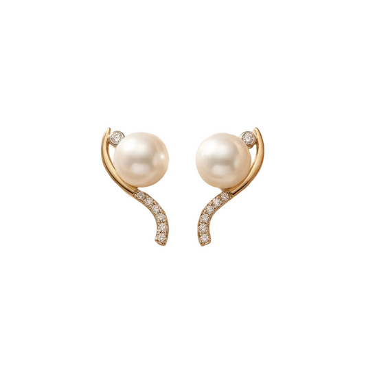 Gold curved earrings with a white pearl at the top and a pave diamond lower arc. Luxe gifts for her under Rs. 60,000