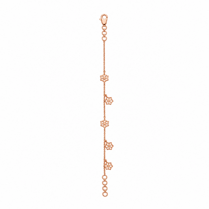 Delicate rose gold vertical chain bracelet with small flower and bead station charms priced under Rs. 35,000