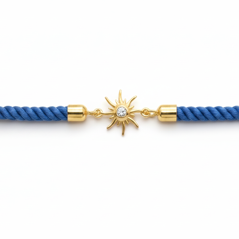 Blue rope men's diamond bracelet with an 18kt gold sunburst charm and diamond center. A minimal gift for him under Rs. 15,000