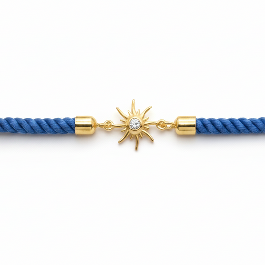 Blue rope men's diamond bracelet with an 18kt gold sunburst charm and diamond center. A minimal gift for him under Rs. 15,000