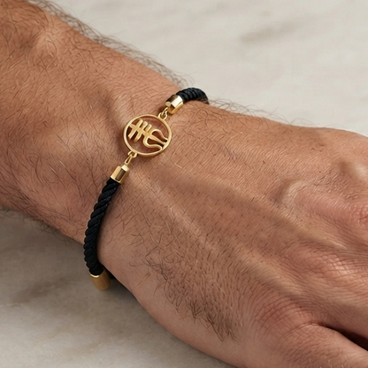 Black rope men's gold bracelet featuring an 18kt gold Trishul symbol charm pendant under Rs. 15,000