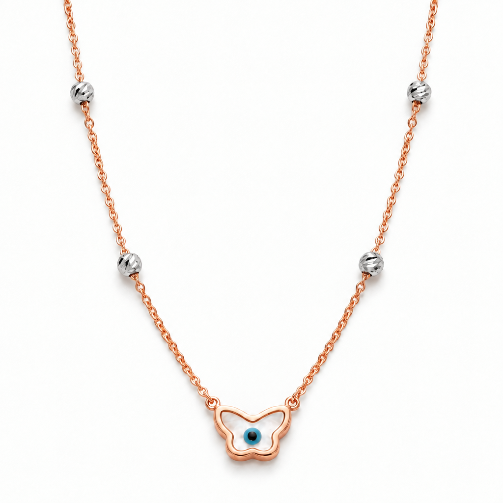 Rose gold chain necklace with a butterfly-shaped evil eye pendant and crystal bead stations. Luxe gifts for her under Rs. 60,000