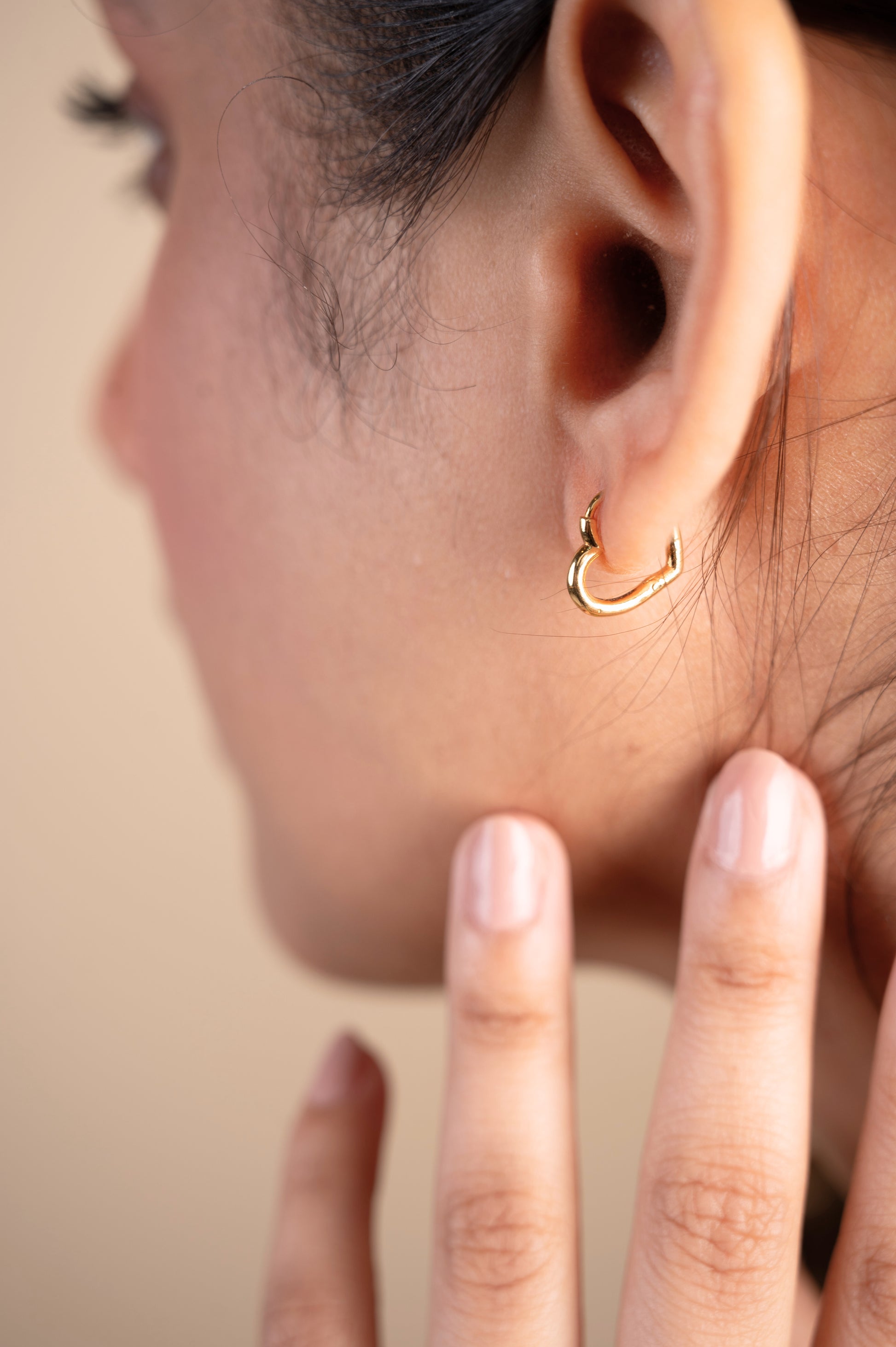 Express your love in style with the Gold Heart Hoop Earrings crafted in 18kt gold under Rs. 30,000. These earrings are a perfect way to add a touch of everyday romance to your look. Versatile enough for casual wear, work attire, or a special occasion, they make a thoughtful and delightful gift idea for her.