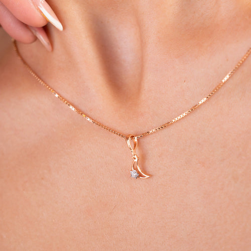 Elevate your style with our 18 kt Moonlit Diamond Pendant from the Spring Edit, priced affordably under Rs. 10,000. This versatile piece seamlessly transitions from day to night, making it a perfect addition to her jewellery collection. Whether for everyday wear or special occasions, it exudes timeless elegance.