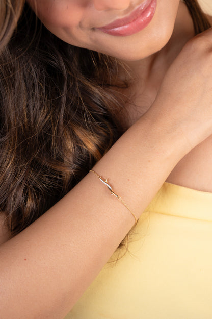 Discover timeless elegance with our 18kt Gold Entwined Diamond Bracelet from the spring edit collection. Priced under Rs. 30,000, this exquisite piece is perfect for everyday wear and gifting, adding sophistication to any outfit. Treat yourself or your loved ones to this luxurious accessory, crafted to elevate your style.