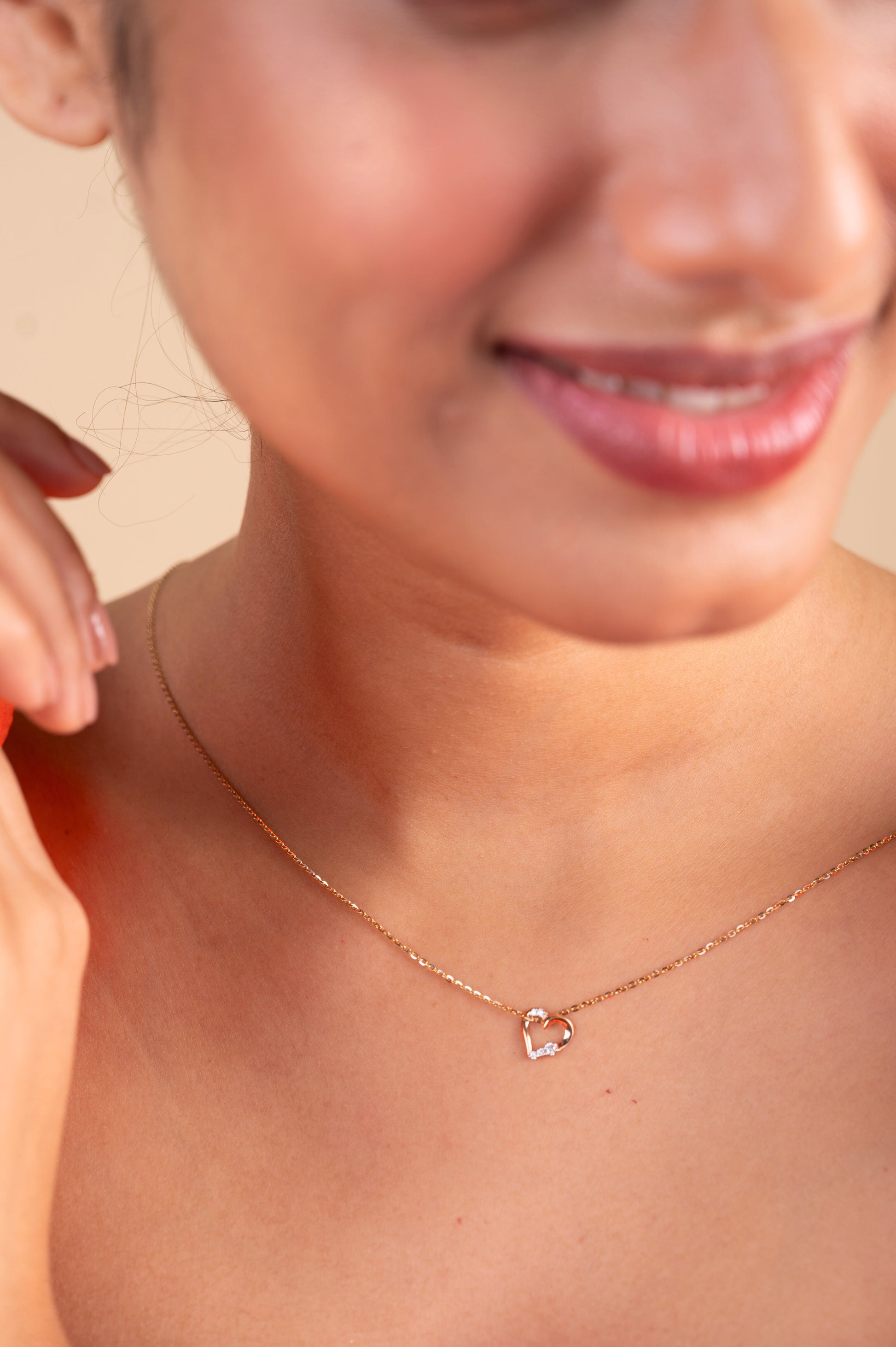 Infuse your style with love through our 18 kt Tiny Heart Pendant from the Spring Edit, priced below Rs. 10,000. Designed to seamlessly transition from day to night, this exquisite jewelry piece adds a touch of charm to any ensemble, making it a perfect addition to her collection or a thoughtful gifting idea.